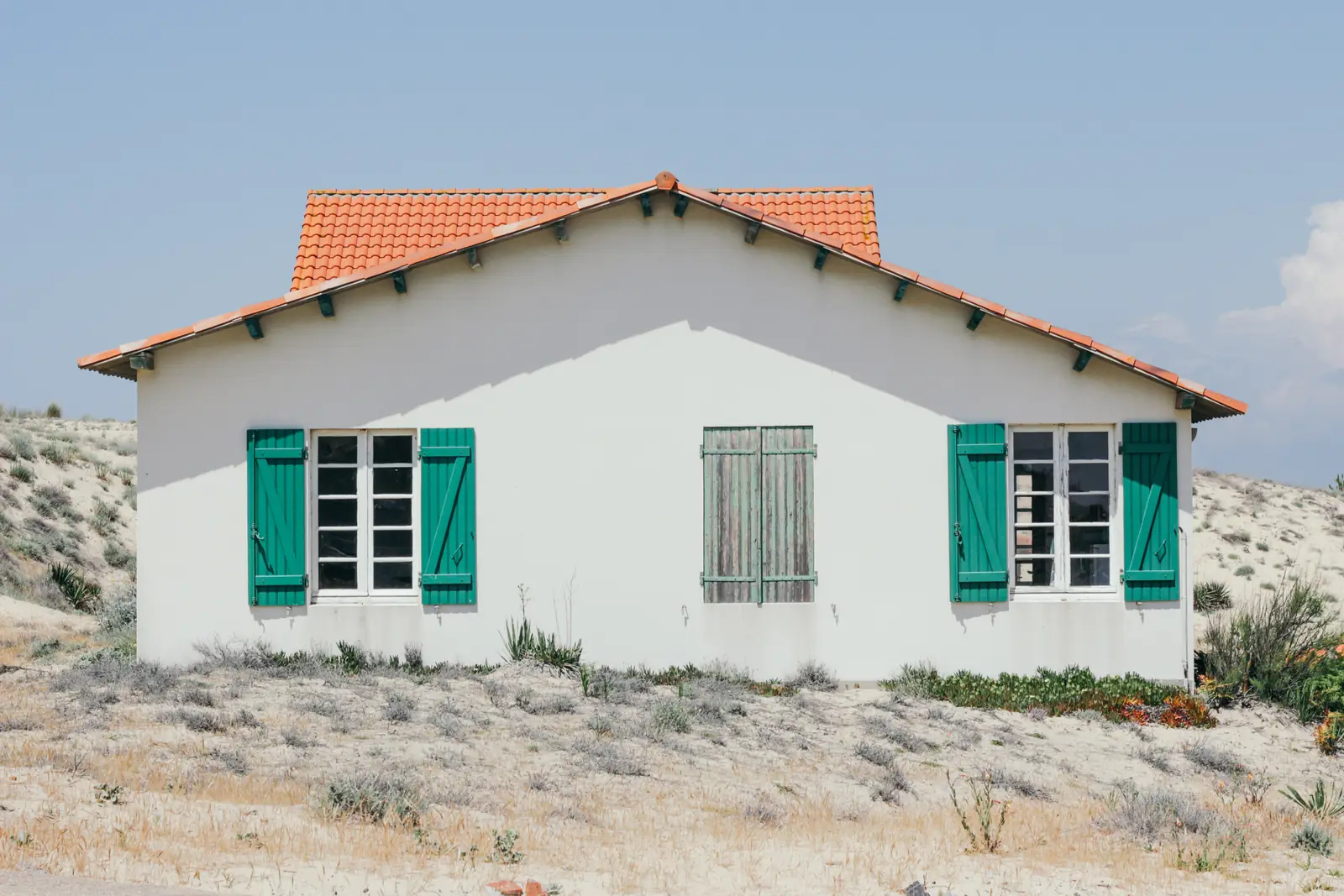 Home with a red clay tile roof