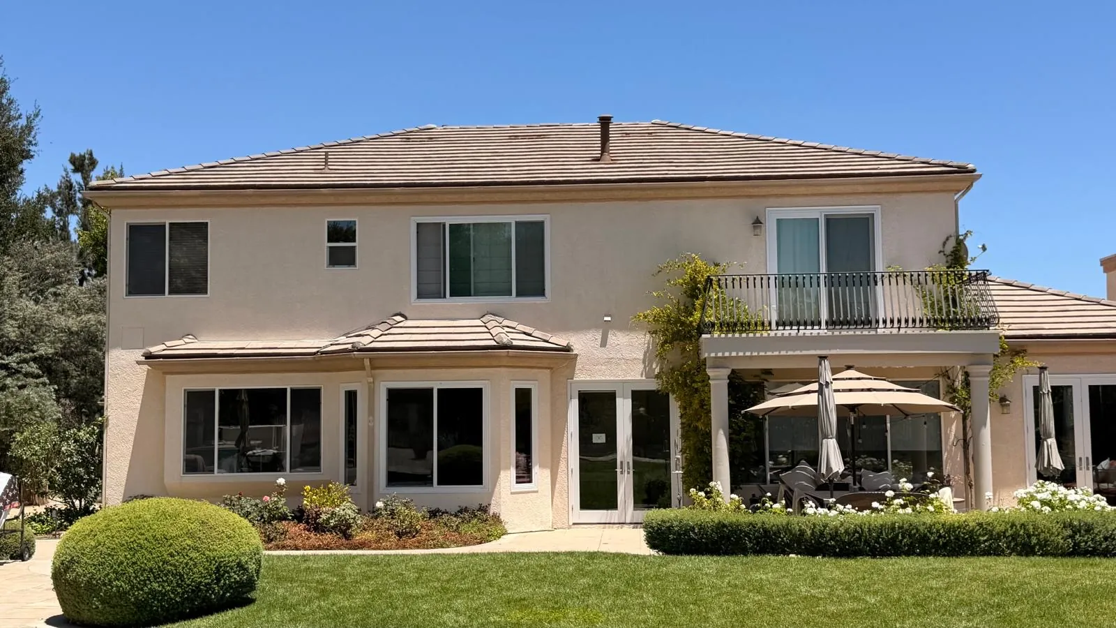 Back of the two-story Agoura Hills home with its relaid concrete tile roof